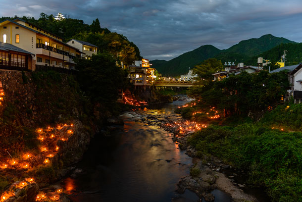Yoshida River lit at night during Gujo Odori